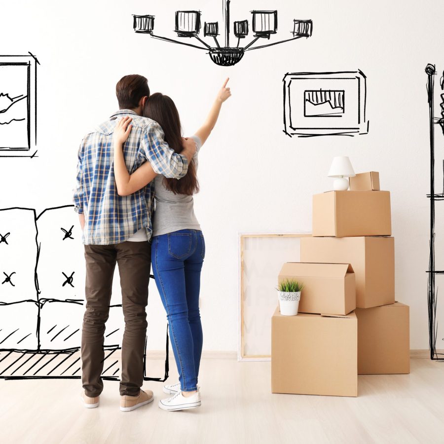 Young couple imagining interior of new house. Moving day